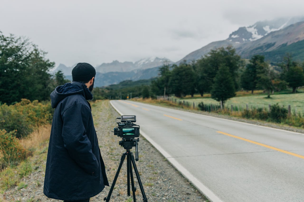 A Man With a Camera by a Road